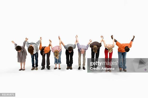 a group of men and women taking a bow together - actor stock pictures, royalty-free photos & images