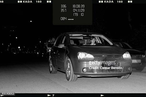 a woman driver getting caught speeding by a speed camera - fotostreifen stock-fotos und bilder