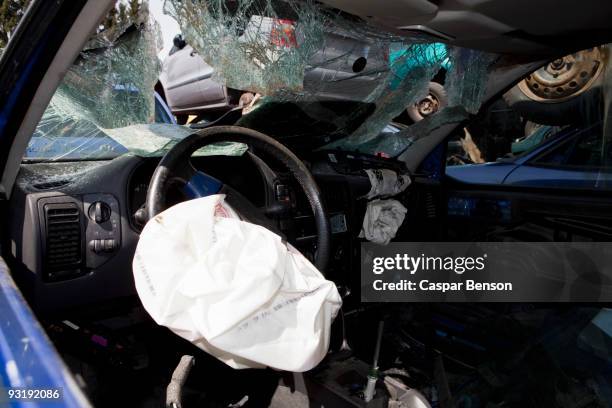 inside of a car in a junkyard - airbag stockfoto's en -beelden