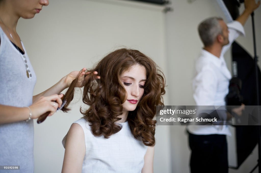 A model having her hair prepared