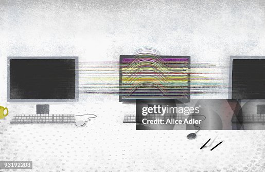 A computer screen with vibrant color amongst darkened computer screens A computer screen with vibrant color amongst darkened computer screens
