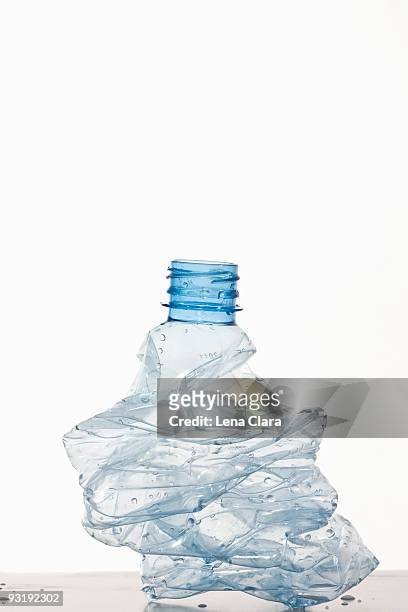 a crumpled plastic water bottle - water bottle on white stock pictures, royalty-free photos & images