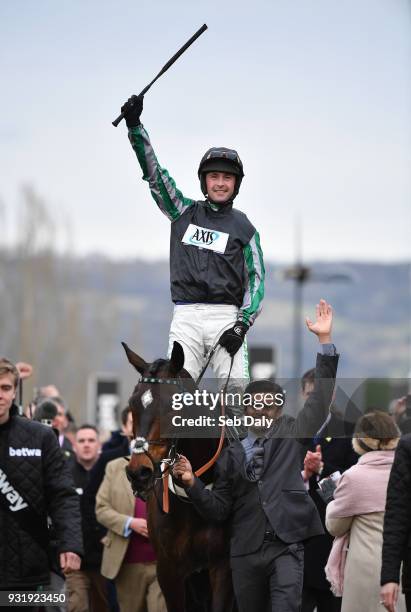 Cheltenham , United Kingdom - 14 March 2018; Jockey Nico de Boinville celebrates as he enters the winners' enclosure after winning the Betway Queen...