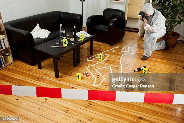 a person photographing a crime scene - contorno de tiza fotografías e imágenes de stock