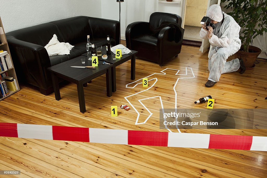 A person photographing a crime scene