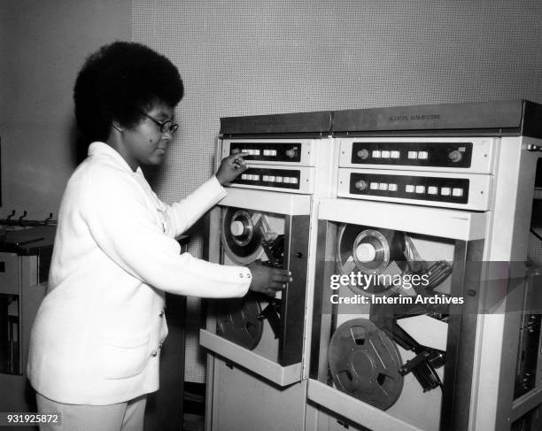 Portrait of American mathematician and scientist Jeanette Scissum as she works with a Scientific Data Systems computer at NASA Marshall Space Flight...