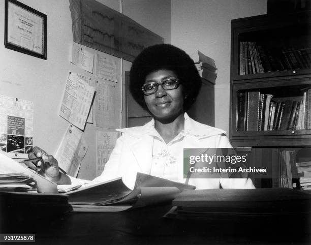 Portrait of African American scientist and mathematician Jeanette Scissum at her desk at NASA Marshall Space Flight Center, Huntsville, Alabama, 1975.