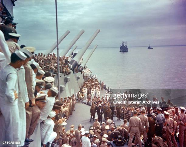 General view of US sailors as they watch the signing of the Japanese Instrument of Surrender on the deck of the USS Missouri, anchored in Tokyo Bay,...