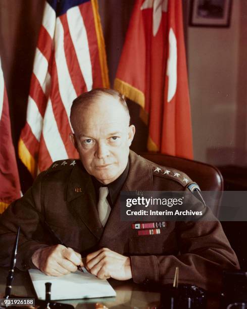 Portrait of American military commander General Dwight D Eisenhower as he sits at his desk, December 1943.