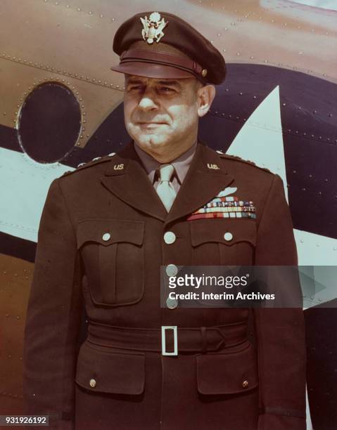 Portrait of American military commander Lieutenant General James Doolittle as he stands next to an airplane, 1940s.