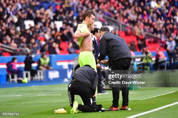 Thiago Motta of PSG receives a red card after his studs land on the chest of Romain Thomas of Angers during the Ligue 1 match between Paris Saint...