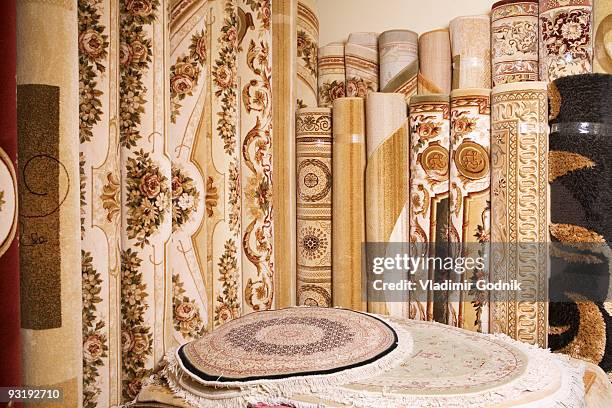 rolls of rugs and carpets - carpet rolls imagens e fotografias de stock