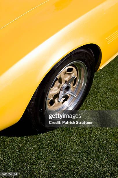 a close-up detail of a yellow sports car - yellow car stock pictures, royalty-free photos & images