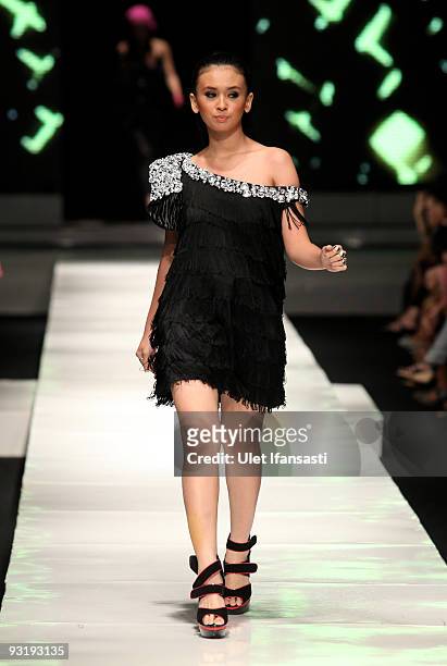 Model showcases designs on the runway by Kanaya Tabitha as part of IPMI Show 3 on day five of Jakarta Fashion Week 2009 at the Fashion Tent, Pacific...