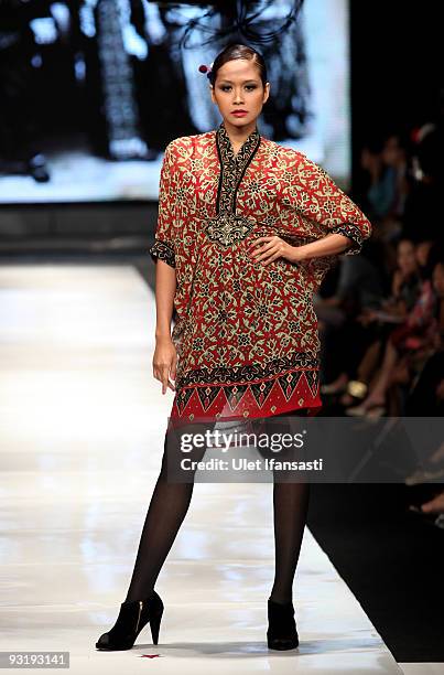 Model showcases designs on the runway by Ghea as part of IPMI Show 3 on day five of Jakarta Fashion Week 2009 at the Fashion Tent, Pacific Place on...