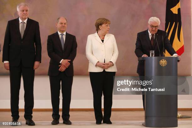 Germany Chancellor Angela Merkel listens to Germany President Frank-Walter Steinmeier near finance Ministry and vice Chancellor, Olaf Scholz and...