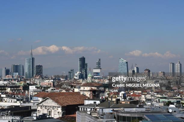 Picture taken from the roof of the Duomo on March 14, 2018 shows a general view of the buildings at the Porta Nuova district in Milan. The Lombard...