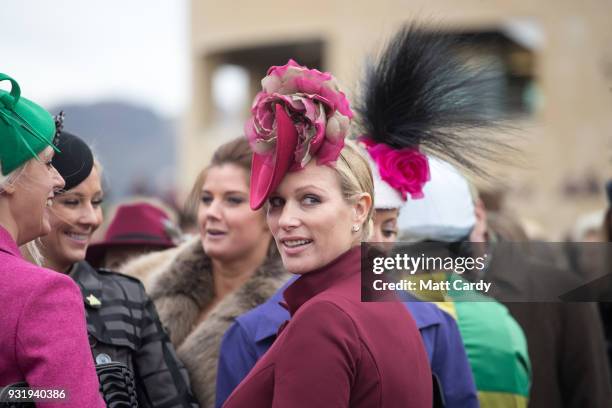 Zara Phillips watches the horses in the parade ring on Ladies Day at the Cheltenham Racecourse on March 14, 2018 in Cheltenham, England. Thousands of...