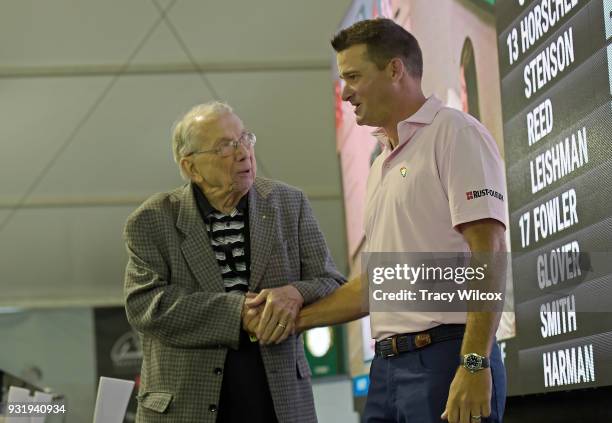 Doc Giffin, long time publicist of Arnold Palmer talks with Palmer's grandson, Sam Saunders during practice for the Arnold Palmer Invitational...