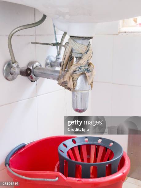 do you need a plumber? - broken pipe stockfoto's en -beelden