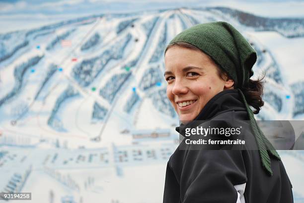 young woman checking sky lift map - woman on ski lift stock pictures, royalty-free photos & images