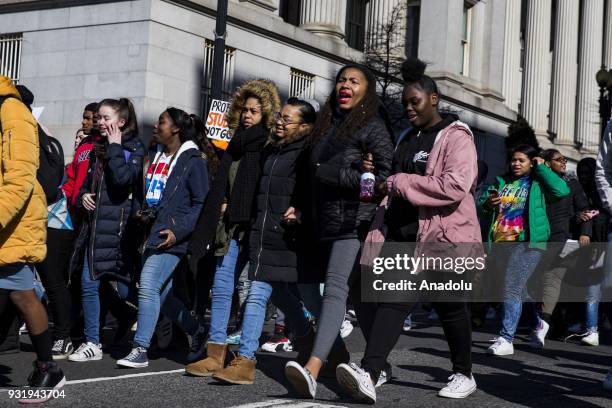 Thousands of students march along Pennsylvania Avenue towards the U.S. Capitol to protest for greater gun control after walking out of classes in the...