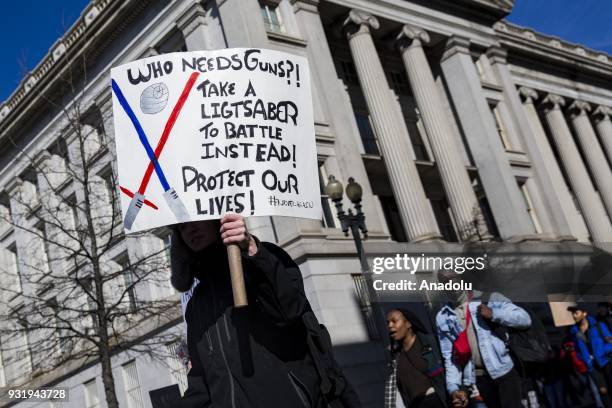 Thousands of students march along Pennsylvania Avenue towards the U.S. Capitol to protest for greater gun control after walking out of classes in the...