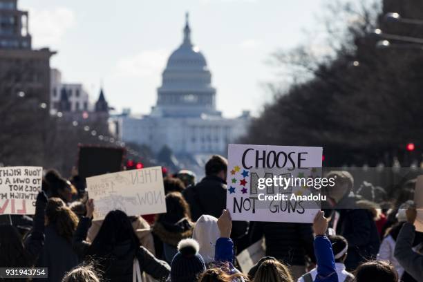 Thousands of students march along Pennsylvania Avenue towards the U.S. Capitol to protest for greater gun control after walking out of classes in the...