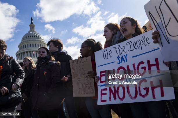 Thousands of students protest in front of the U.S. Capitol for greater gun control after walking out of classes in the aftermath of the shooting...