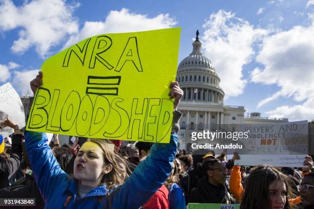 Thousands of students protest in front of the U.S. Capitol for greater gun control after walking out of classes in the aftermath of the shooting...
