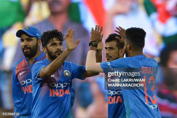 Indian cricketer Shardul Thakur celebrates with his teammates after he dismissed Bangladesh cricketer Sabbir Rahman during the Fifth Match, Nidahas...