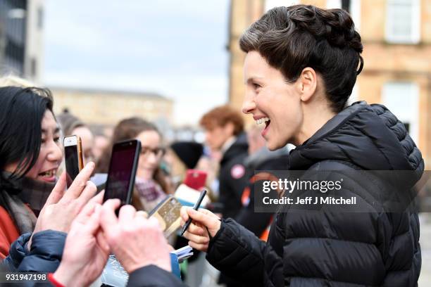 Caitriona Balfe from the TV series Outlander meets fans who were waiting in St Andrew's Square on March 14, 2018 in Glasgow,Scotland. Dozens of fans...