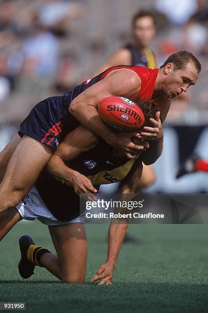 David Neitz of Melbourne and Darren Gasper of Richmond in action during the A.F.L. Round 1 match played between the Melbourne Demons and the Richmond...