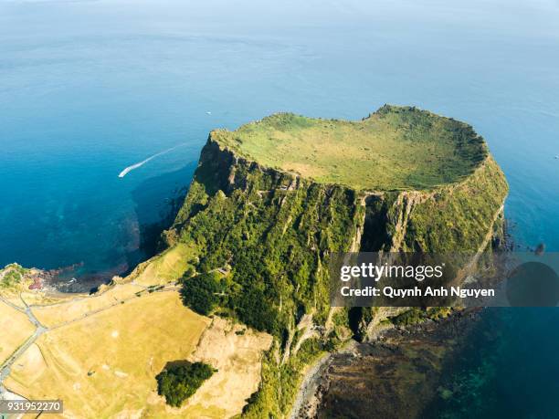 south korea: seongsan ilchulbong crater in jeju island - jeju island stock pictures, royalty-free photos & images