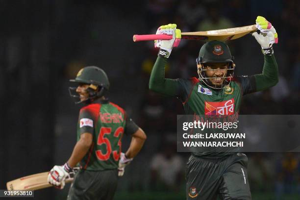 Bangladesh cricketer Mustafizur Rahman runs between wickets next to teammate Sabbir Rahman during the Fifth Match, Nidahas Twenty20 Tri-Series...