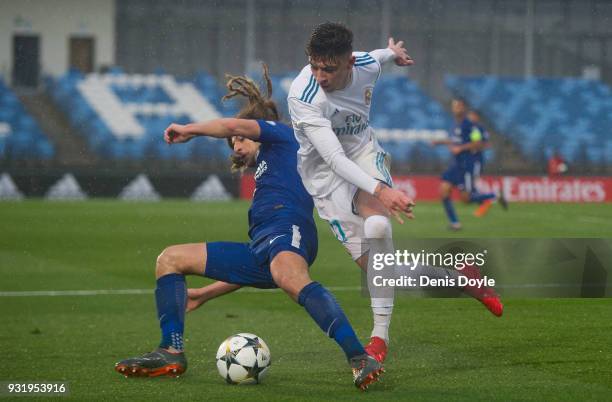 Cesar Gelabert Pina of Real Madrid is tackled by Ethan Ampadu of Chelsea during the UEFA Youth League Quarter-final between Real Madrid and Chelsea...