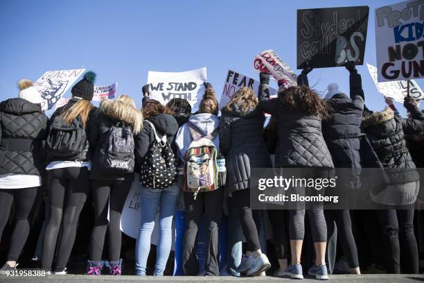 Students turn their backs to the White House during the ENOUGH: National School Walkout rally in Washington, D.C., U.S., on Wednesday, March 14,...