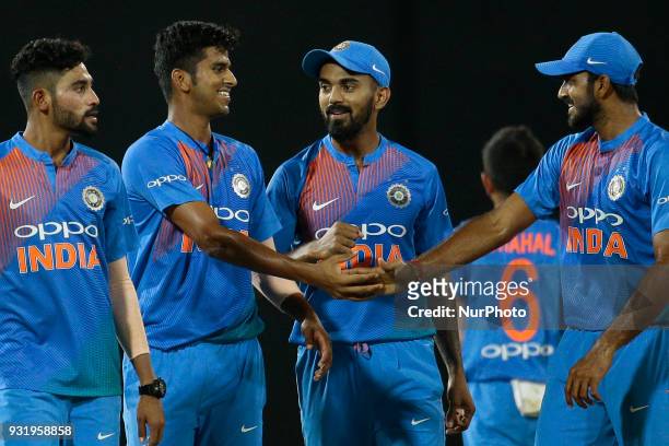 Indian cricketer Washington Sundar congratulated by his team members during the 5th Twenty-20 cricket match of NIDAHAS Trophy between Bangladesh and...
