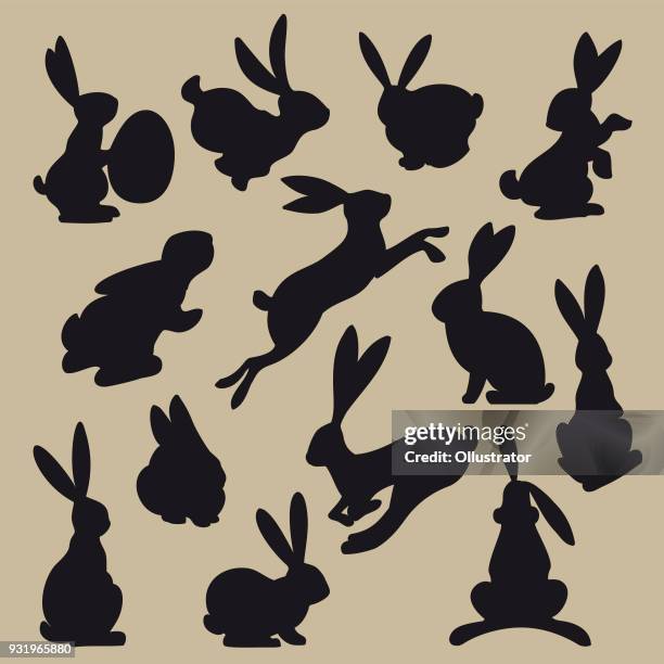 ilustrações de stock, clip art, desenhos animados e ícones de collection of black easter rabbit silhouettes - coelhinho da páscoa