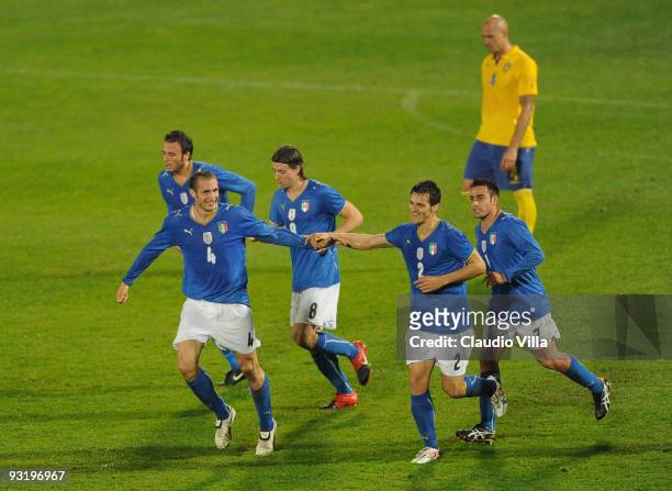 Giorgio Chiellini of Italy celebrates after scoring the opening goal with team mate Christian Maggio during the international friendly match between...