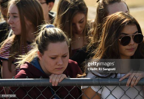 Students at Columbine High School walk out of classes in protest of gun violence for 17 minutes, one minute for each Florida high school shooting...