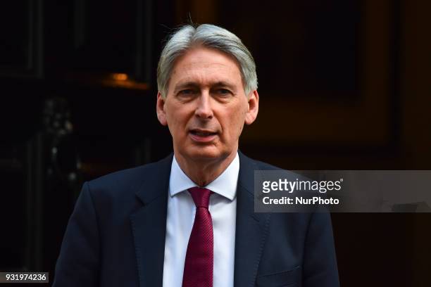 Britain's Chancellor of the Exchequer Philip Hammond leaves 11 Downing street, London on March 14, 2018.