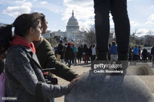 Students stand outside the U.S. Capitol building during the ENOUGH: National School Walkout rally in Washington, D.C., U.S., on Wednesday, March 14,...