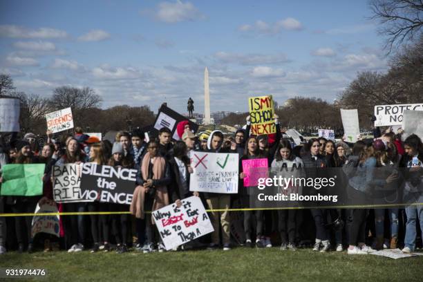 The Washington Monument stands as students hold signs during the ENOUGH: National School Walkout rally in Washington, D.C., U.S., on Wednesday, March...