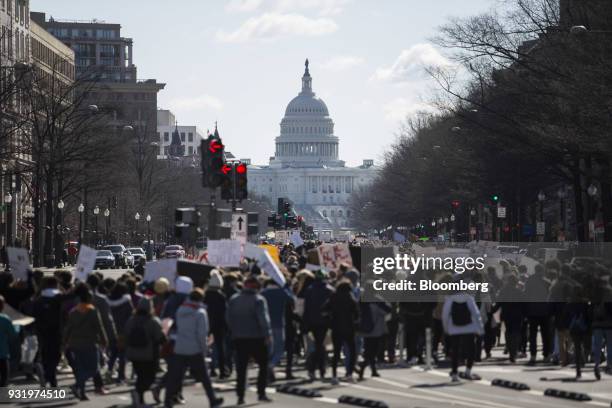 Students march towards the U.S. Capitol building during the ENOUGH: National School Walkout rally in Washington, D.C., U.S., on Wednesday, March 14,...