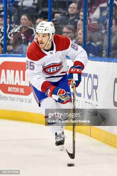 Montreal Canadiens right wing Andrew Shaw looks for options as he circles the opposing net during the first period of an NHL game between the...