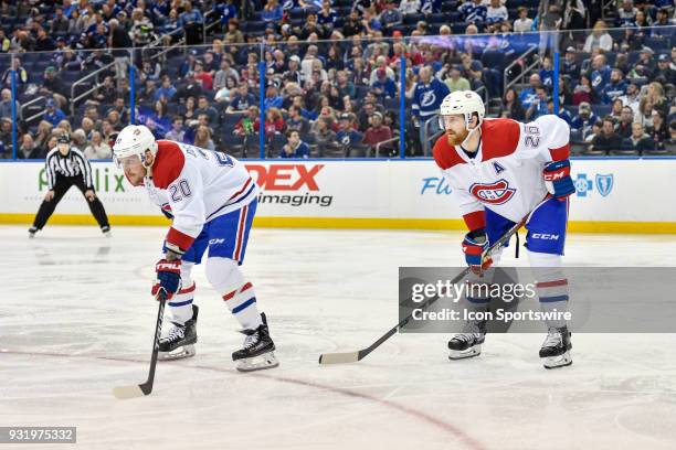 Montreal Canadiens left wing Nicolas Deslauriers and Montreal Canadiens defender Jeff Petry wait for the puck to drop during the second period of an...