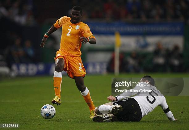 Heiko Westermann of Germany challenges Emmanuel Eboue of Ivory Coast during the international friendly match between Germany and Ivory Coast at the...