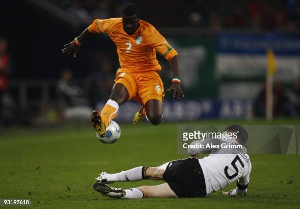 Heiko Westermann of Germany challenges Emmanuel Eboue of Ivory Coast during the international friendly match between Germany and Ivory Coast at the...