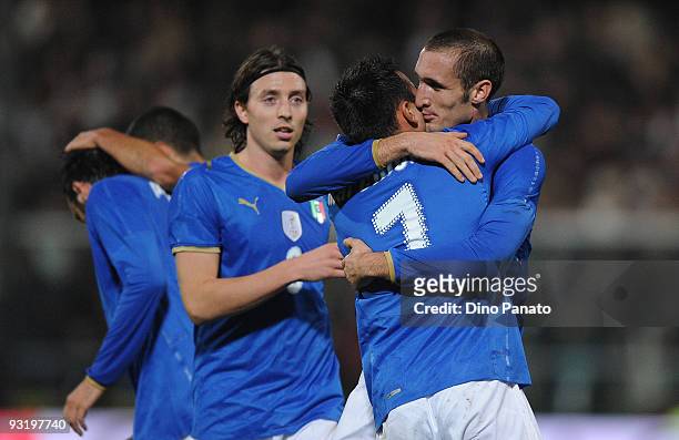 Giorgio Chiellini of Italy celebrates his opening goal with team mate Marco Marchionni during the international friendly match beetwen Italy and...